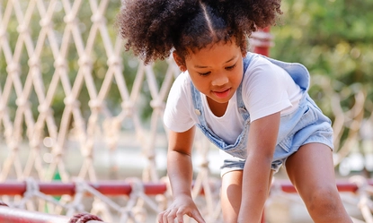 boy-playing-slide-playground