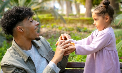 father-spending-time-with-his-daughter-outdoors-father-s-day 1