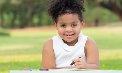 happy-family-enjoying-picnic-park-girl-are-having-fun-drawing-paper-placed-table