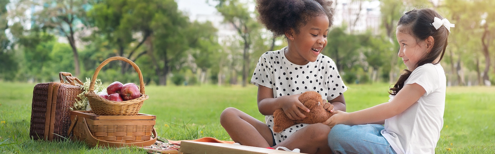 mother-daughter-sitting-wicker-basket