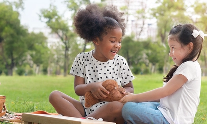 mother-daughter-sitting-wicker-basket