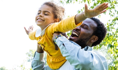 portrait-smiling-young-woman-exercising-field