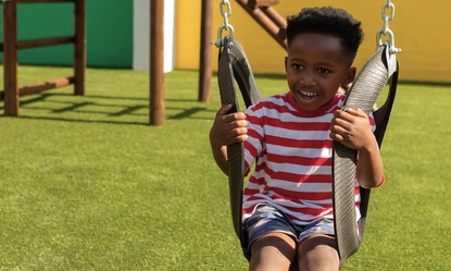 schoolboy-playing-swing-school-playground